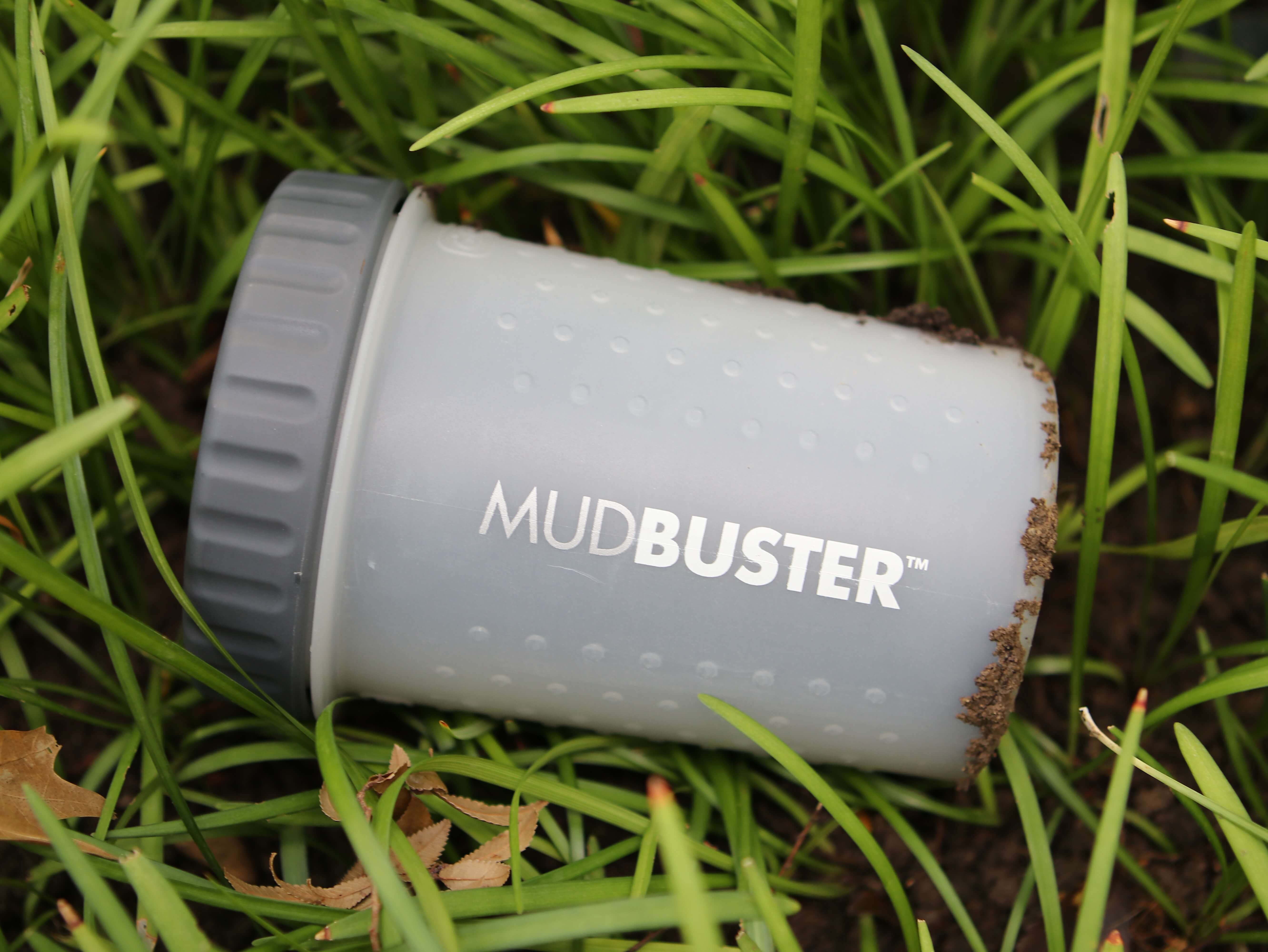 Dexas dog paw cleaner mudbuster small in grass