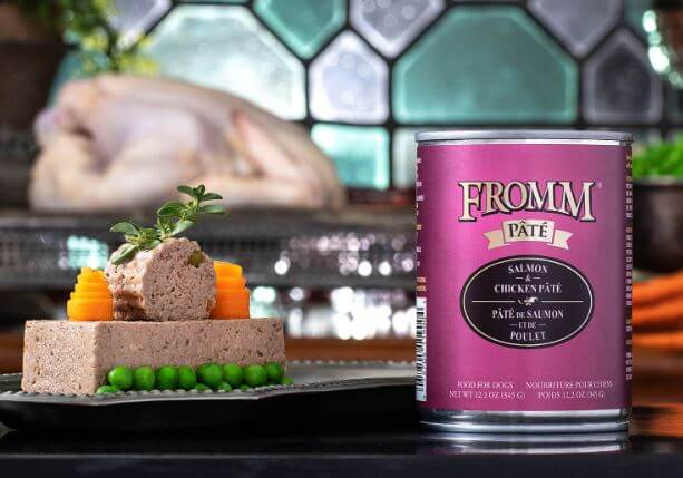 Fromm Salmon and Chicken Recipe can next to savory ingredients