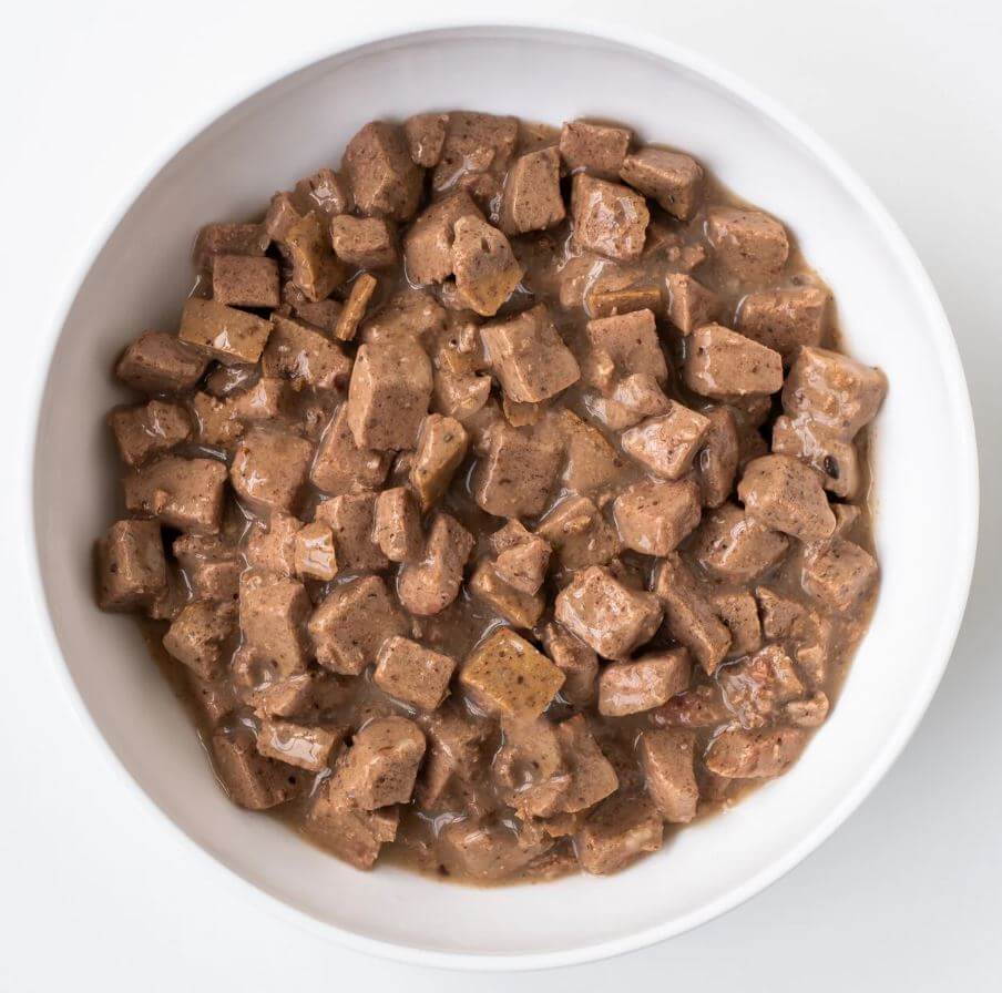 Koha Grain-Free Turkey Stew with open lid to show meat chunks in savory recipe for your pup