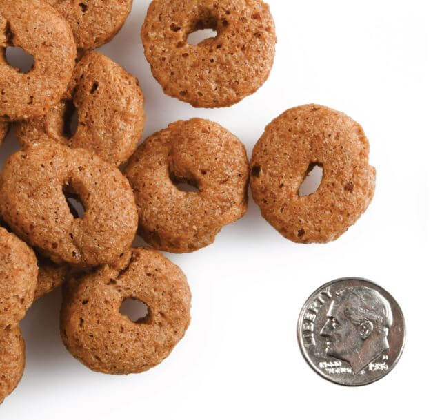 Crunchy Os treats size comparison to a dime.